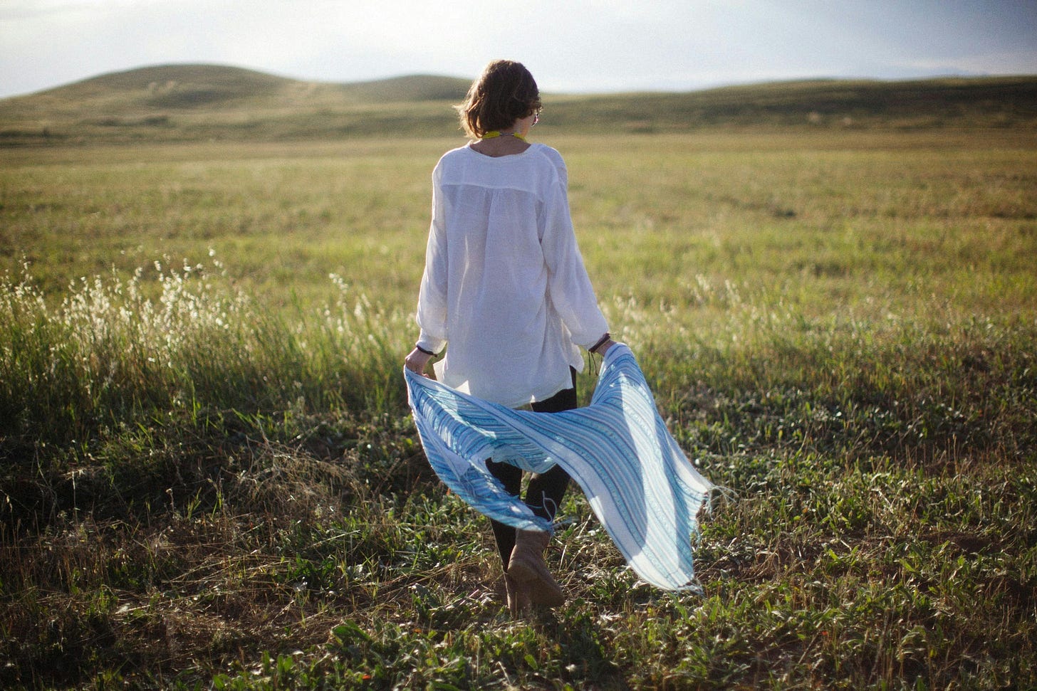 Back View of a Woman Walking in the Grass Field · Free Stock Photo Back View of a Woman Walking in the Grass Field · Free Stock Photo