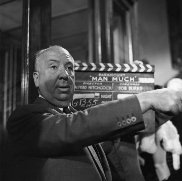 Film director and auteur Alfred Hitchcock filming 'The Man Who Knew Too Much', a Paramount remake of his 1934 spy thriller.