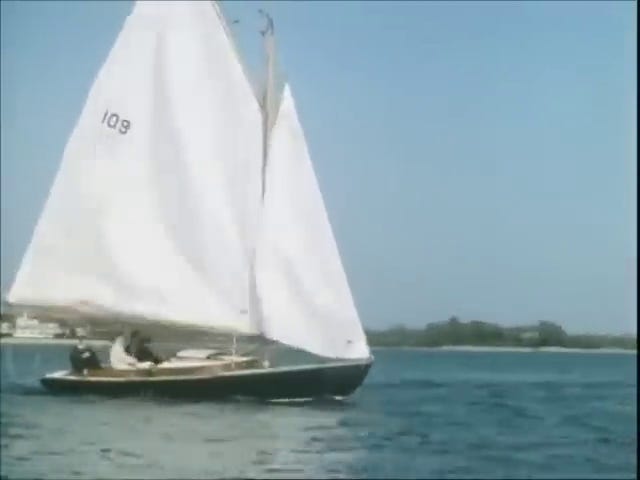 The Kennedys and Dave sailing; JFK's sailboat (note the number 109 written on the sail).