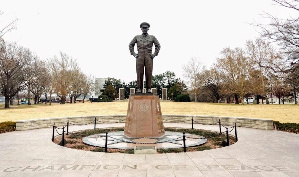 man statue on brown concrete floor