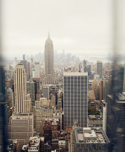 May be an image of Times Square and skyscraper