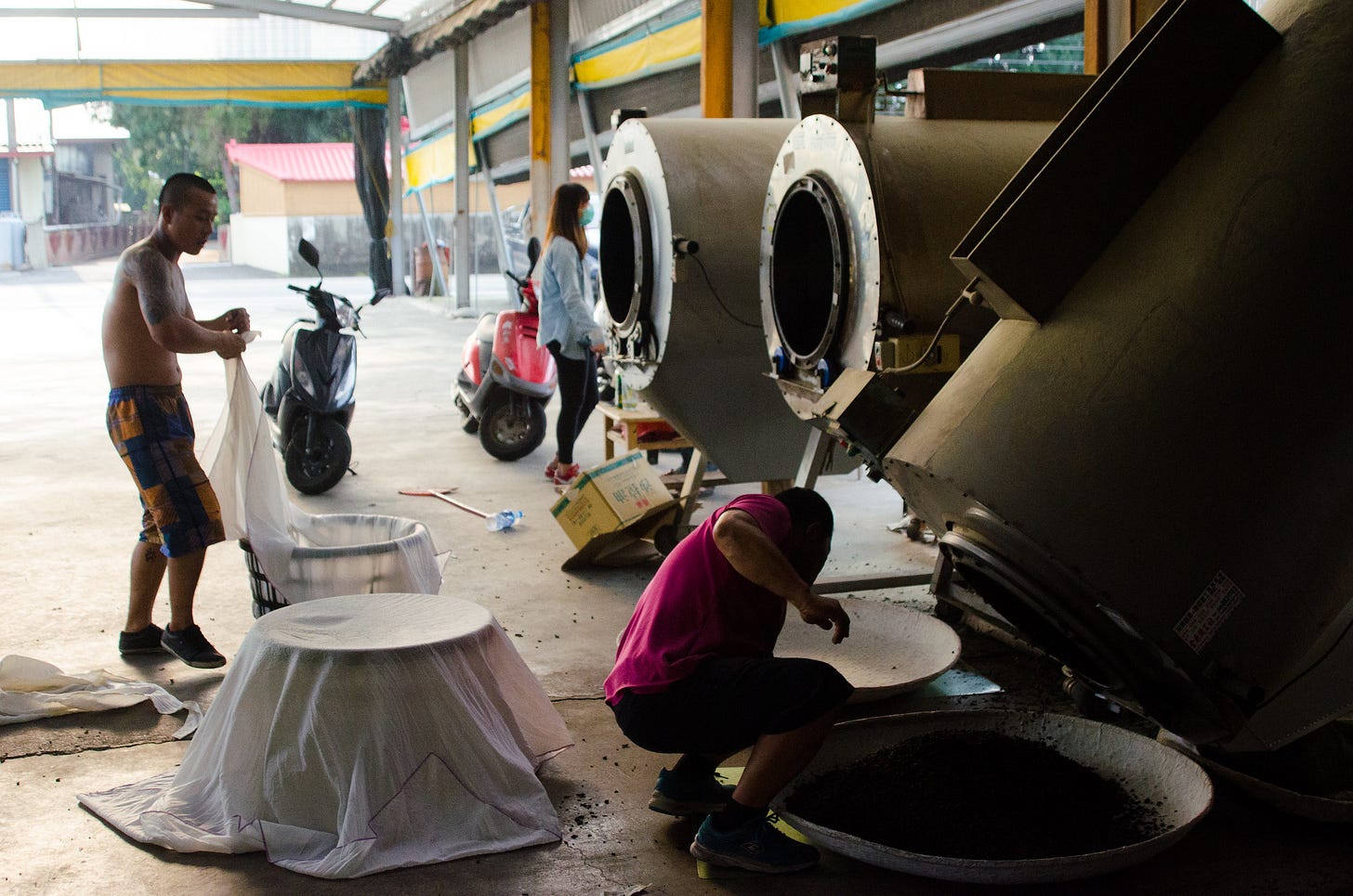 ID: Two men working in a tea factory in Taiwan