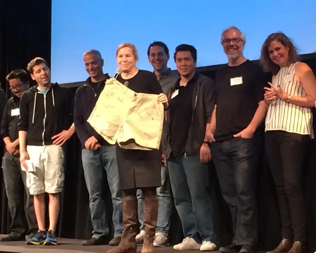 Group of Y Combinator partners and alumni on stage during YC’s 2014 winter batch demo event.