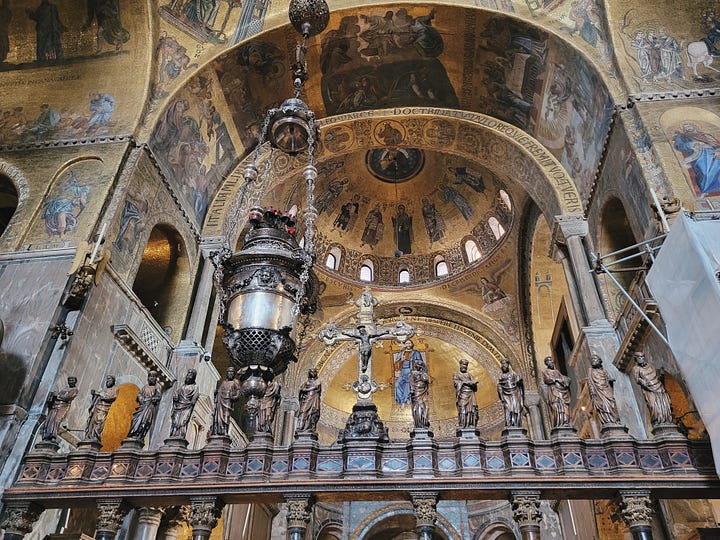 Golden mosaics inside St. Mark's Basilica and monumental paintings framed by a gilded ceiling inside the Doge's Palace in Venice