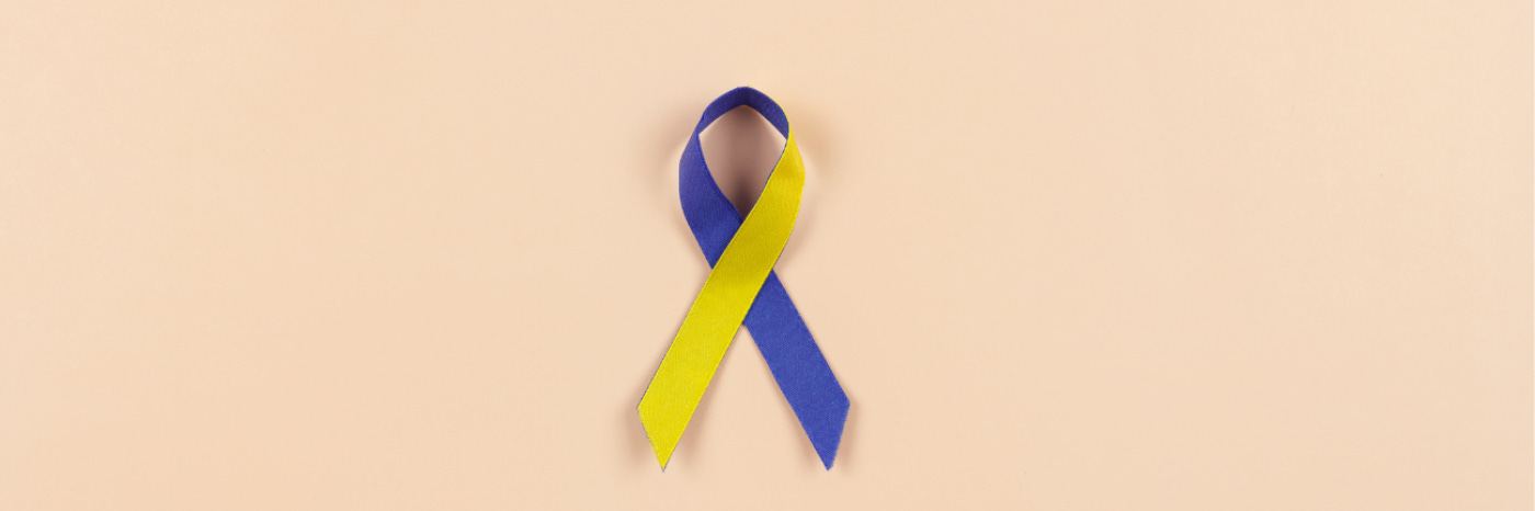 A picture of a blue and yellow ribbon that is the primary symbol for Down syndrome awareness. A picture of a blue and yellow ribbon that is the primary symbol for Down syndrome awareness.