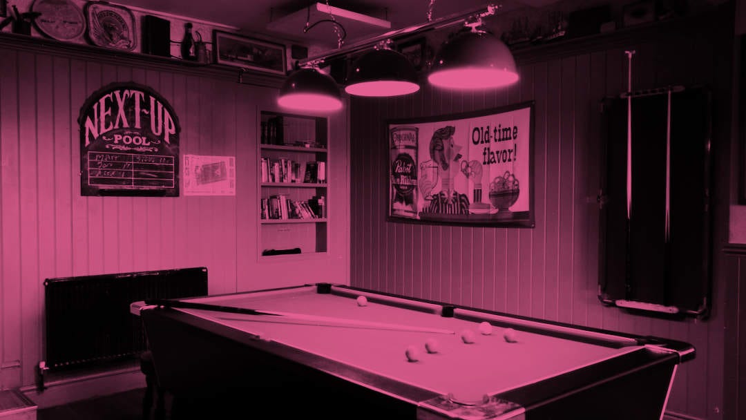 A corner of a pub with a pool table. A corner of a pub with a pool table.