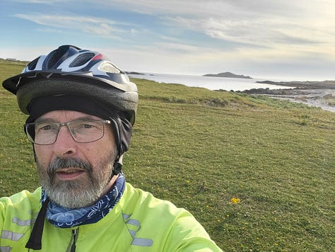 Map of Omey Island, three pictures showing beauty of Omey Island and Joe in his bicycle helmet and hi-vis bike jacket