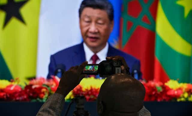 Man records a live speech. Man records a live speech.
