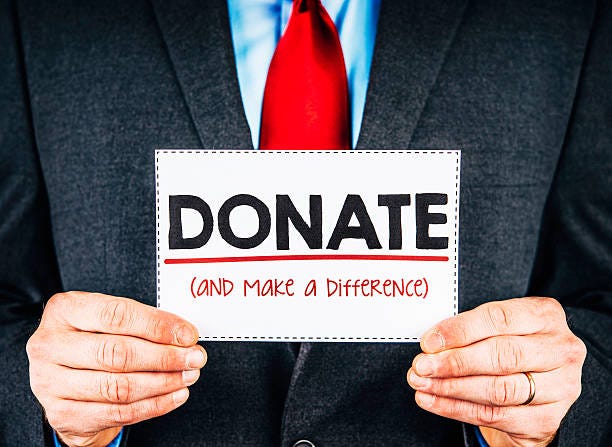 Businessman with donate sign Businessman with donate sign Corporate Charitable donation stock pictures, royalty-free photos & images Businessman with donate sign Businessman with donate sign Corporate Charitable donation stock pictures, royalty-free photos & images