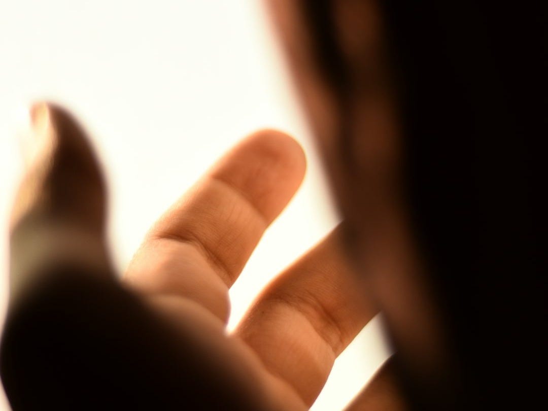 a close up of a person holding a cell phone