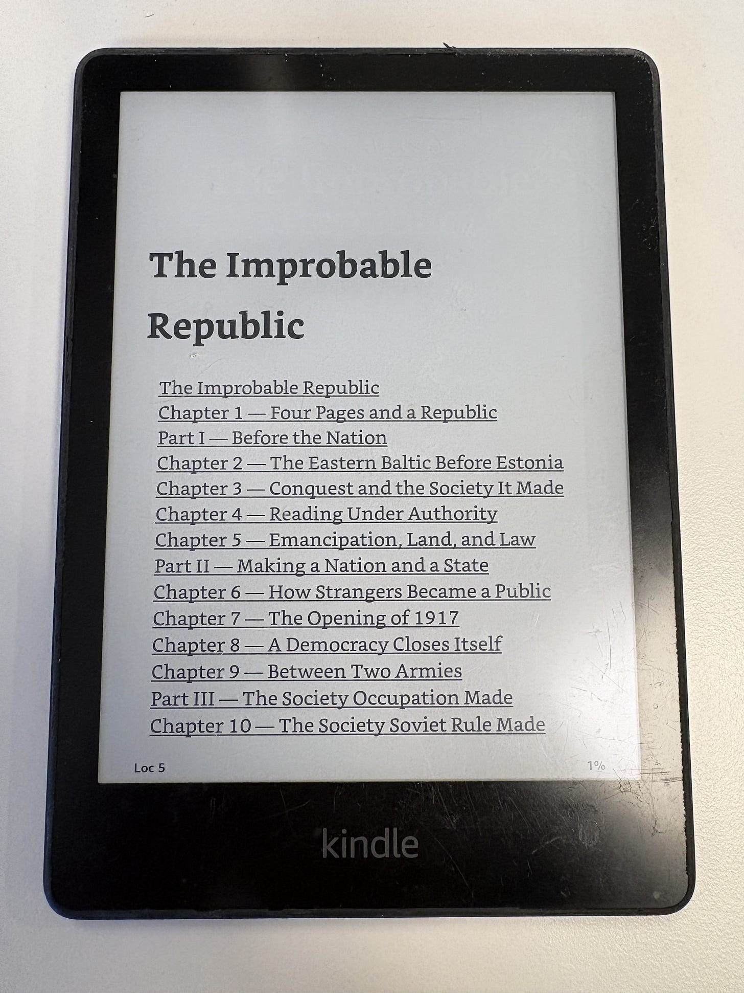 The private Estonia history, The Improbable Republic, open on a well-used Kindle