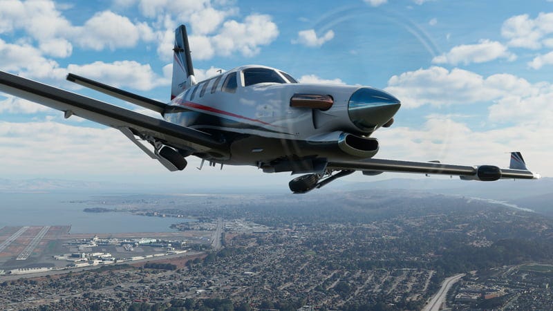 aviao voando acima de cidade em Flight Simulator, novo jogo de simulação da Microsoft