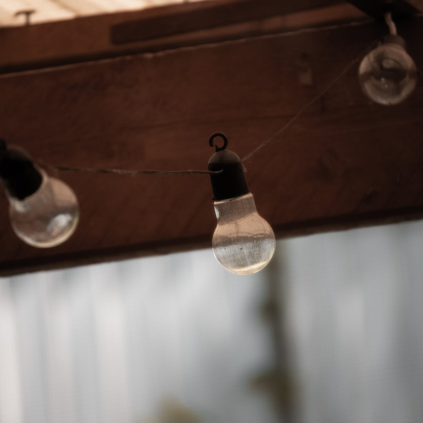 String Lights Hanging Under a Wooden Roof