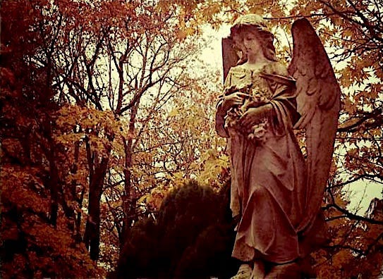 Angel in a local cemetery, many years ago. Photo by JPC.