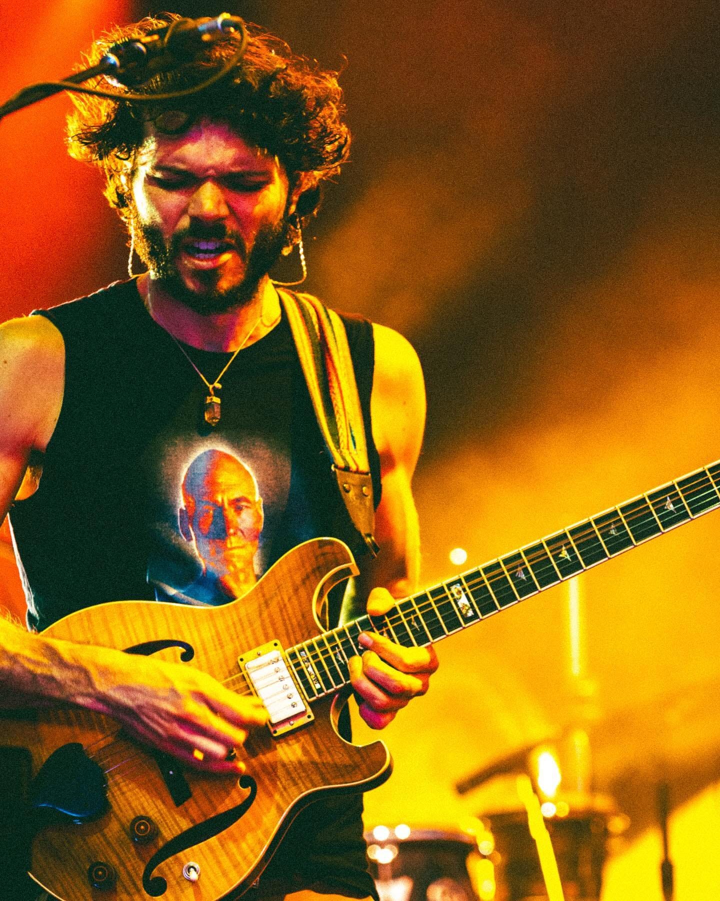 May be an image of 1 person and guitar