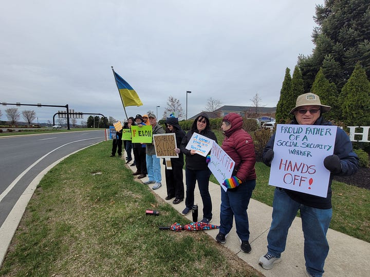 On the left, a phot oof multiple protesters holding signs on a sidewalk along a main road. One is holding a Ukraine flag, another a sign that says F*elon, another that says Disabled Kids Matter. The closest to the camera is a man with a sign saying "Proud Father of a Social Security Worker, Hands Off!" On the right, a woman holds a sign saying "Speak Up While It's Still Legal"