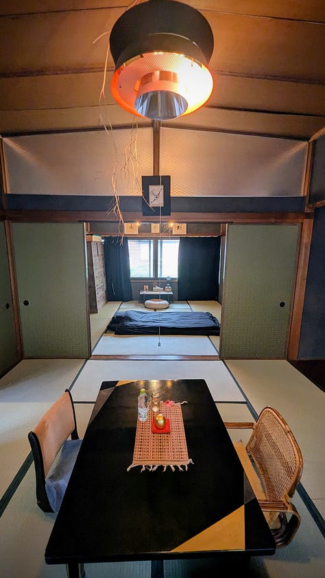 Japanese-style rooms, bowls of food, and bottles of sake.