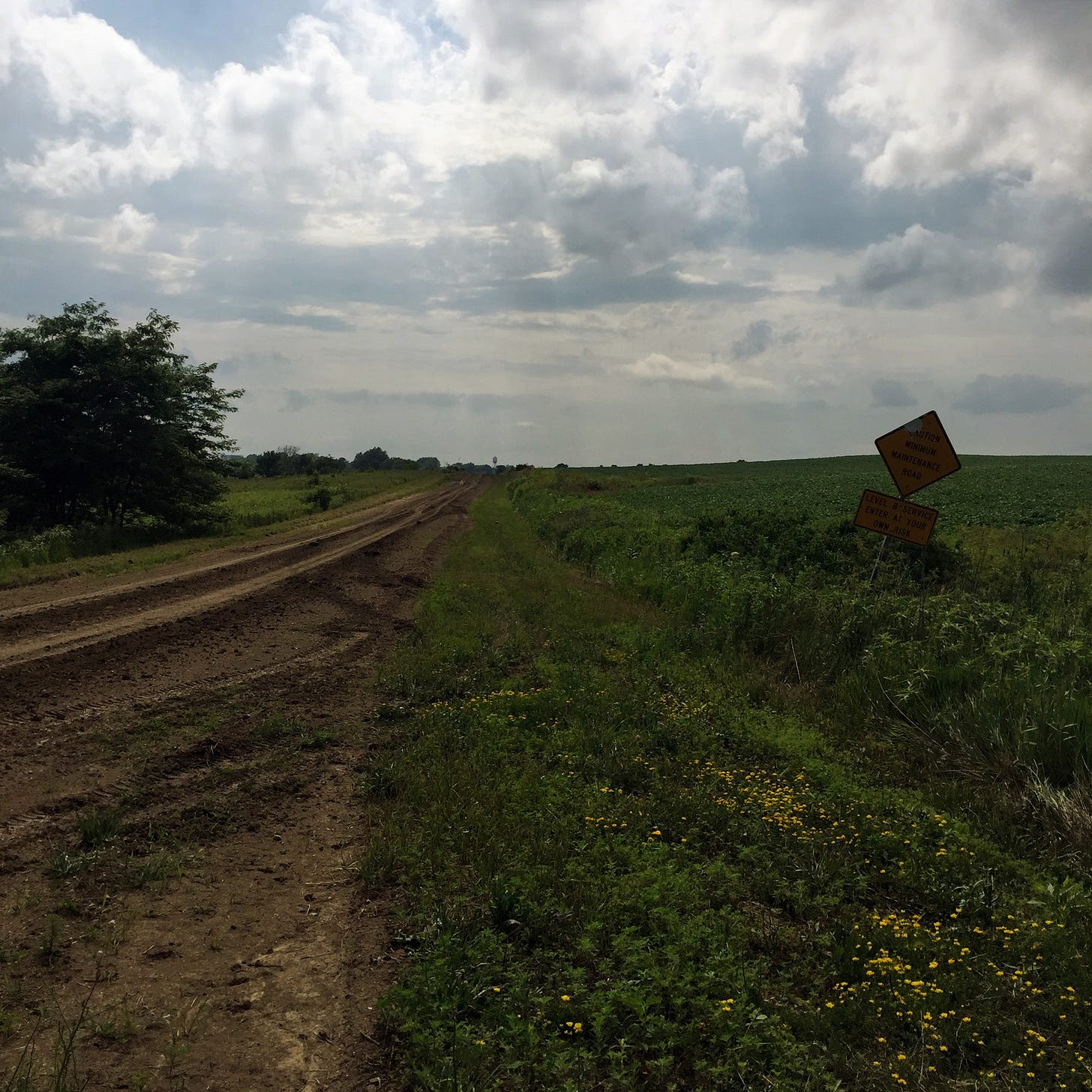 Dirt road with clouds in the distance