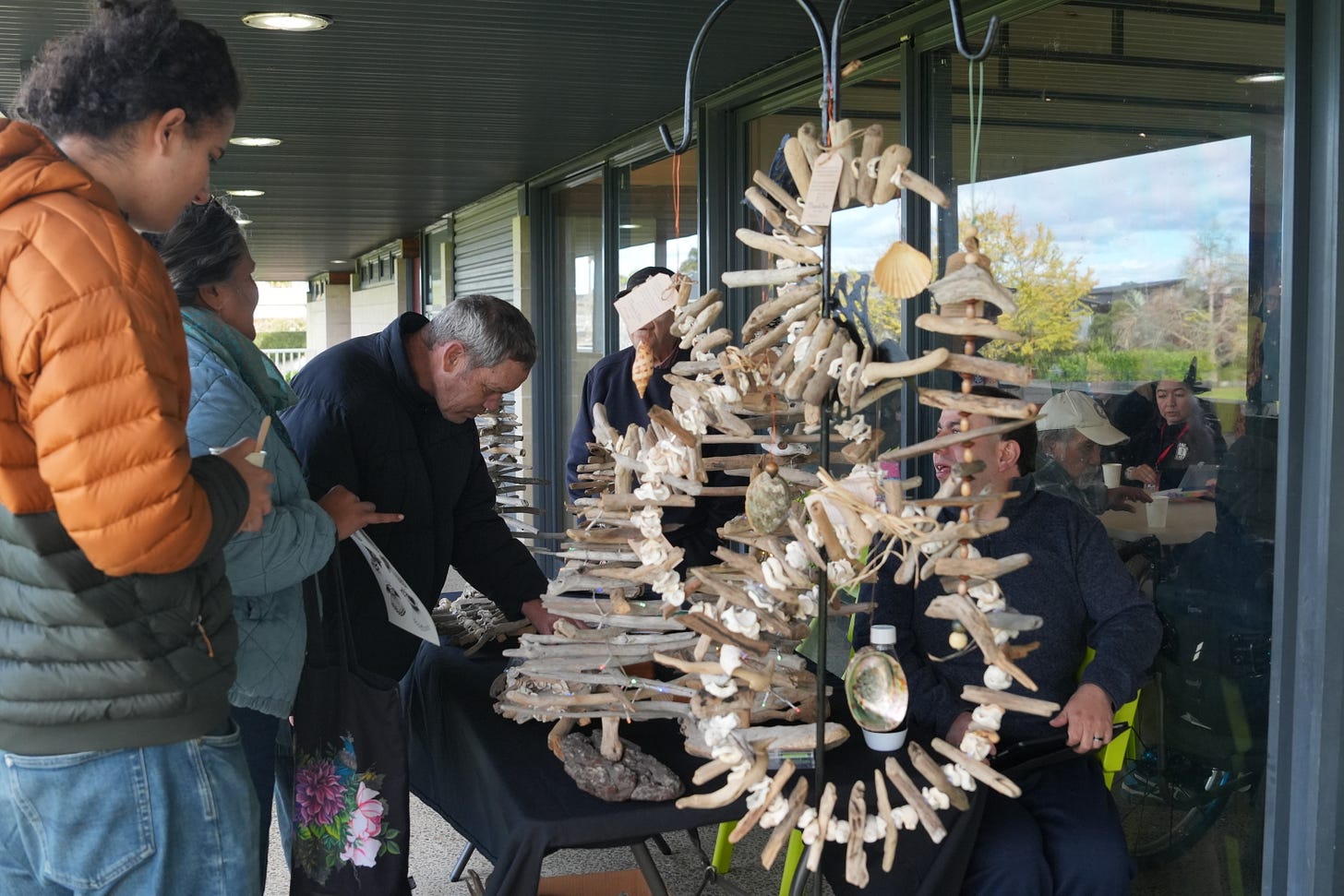 Market goers enjoy the Matariki market