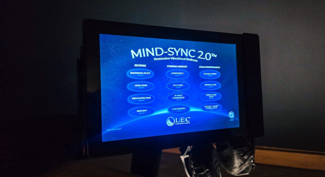 A blue LED screen with writing in circles A blue LED screen with writing in circles