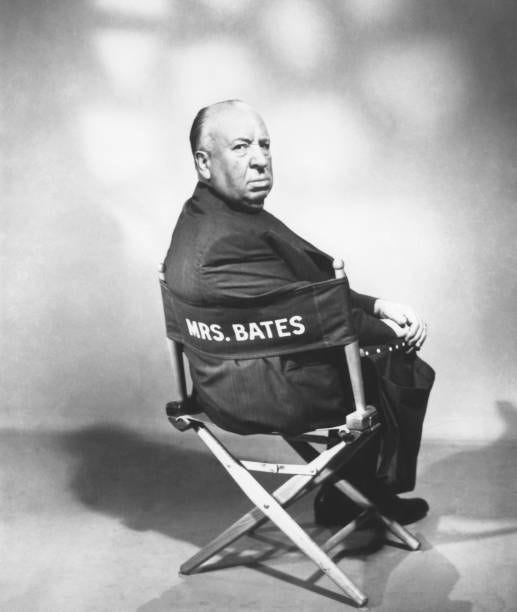 Film director Alfred Hitchcock poses for portrait sitting in Mrs Bates directors chair on the set of his 1960 thriller 'Psycho'.