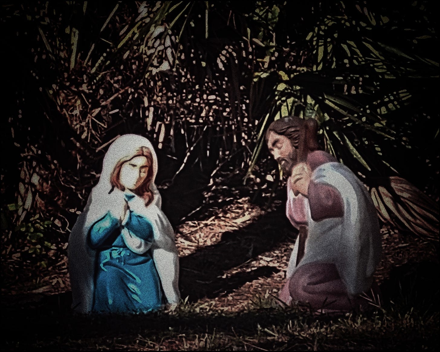 A typical December "manger scene," with Mary and Joseph both kneeling on the ground... but the ground between them is empty.