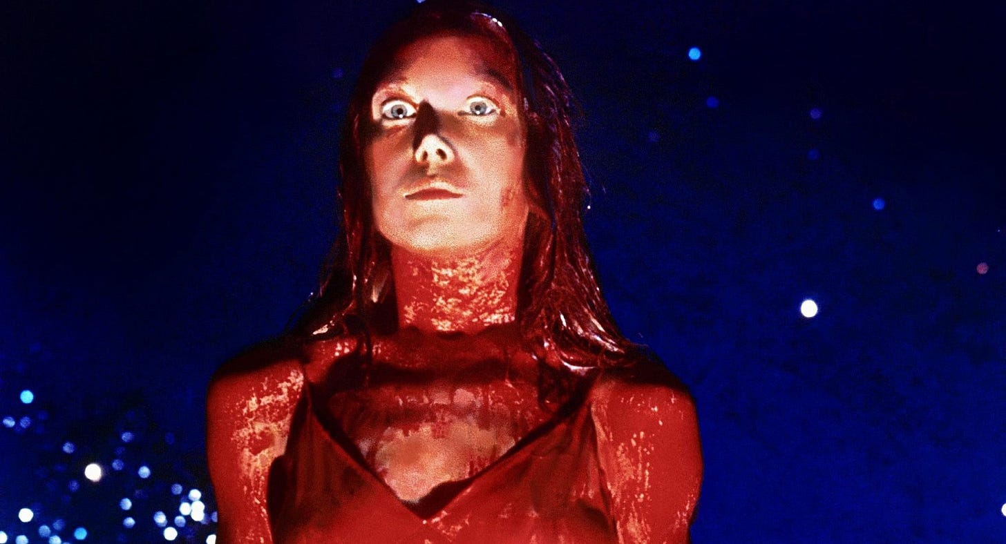 Carrie (1976) - Carrie after having blood poured on her, about to snap