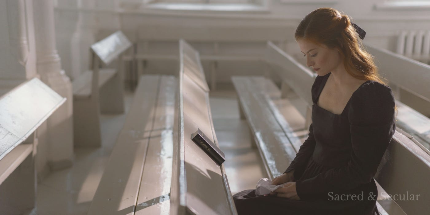 A woman seated in a church funeral