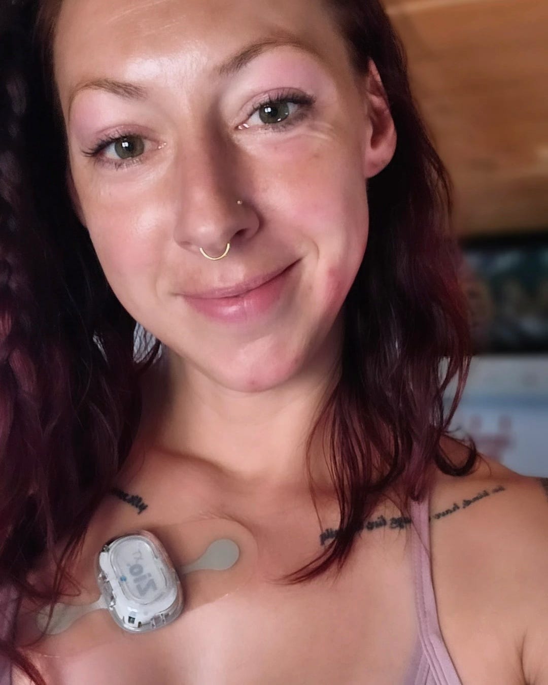 Captain Erica wearing a Holter monitor for tracking heart rhythm.