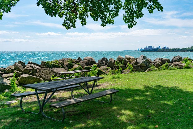 Shaded Picnic Table at a Park along Lake Michigan in Evanston, Illinois. Shaded Picnic Table at a Park along Lake Michigan in Evanston, Illinois.