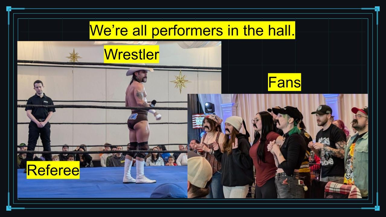 A slide headed “We’re all performers in the hall” presents two professional wrestling photographs. Yellow labels identify a wrestler and referee inside the ring on the left and costumed fans watching from ringside on the right.