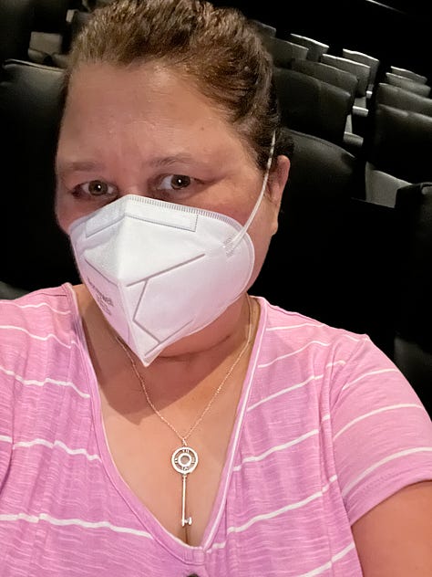 Photos of a girl dressed in pink at the movies seeing Barbie in IMAX
