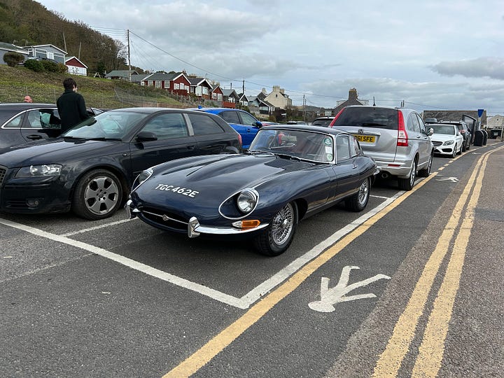 Photo 1 a 1967 Dark Blue E-Type Jaguar in a car park in Lyme Regis. Photo 2 a 1968 Humber Hawk IVA in a Lyme Regis Car Park. Images: Roland's Travels