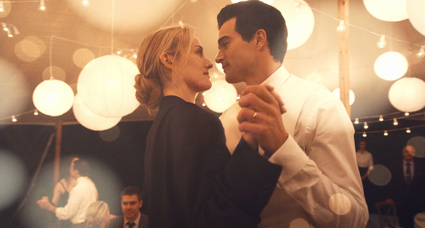 Image may contain Rob Marciano Face Head Person Photography Portrait Adult Wedding Clothing Formal Wear and Suit