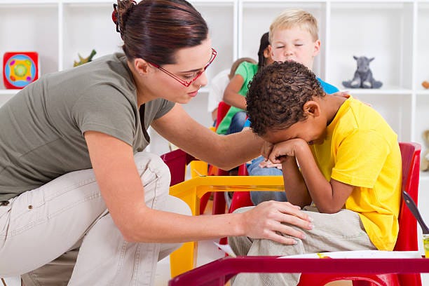 470+ Teacher Comforting Child Stock Photos, Pictures ...