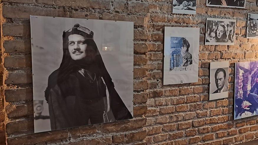 pictures of omar shariff and other hollywood actors on a wall