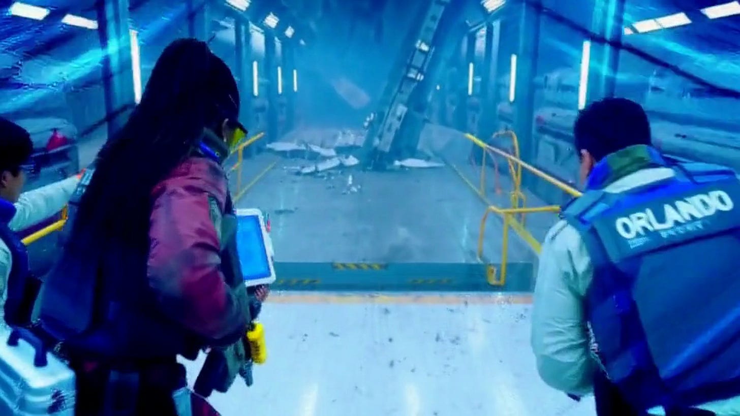 An existing CumeTV Channel 1 scene shows a group moving through a blue-lit space installation. An existing CumeTV Channel 1 scene shows a group moving through a blue-lit space installation.