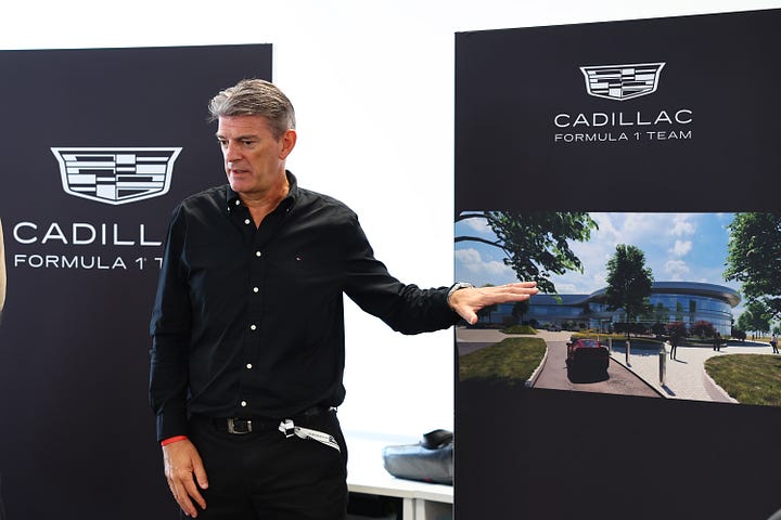 Cadillac F1 team principal Graeme Lowdon shows journalists around on a media day held at their UK satellite base in Silverstone.