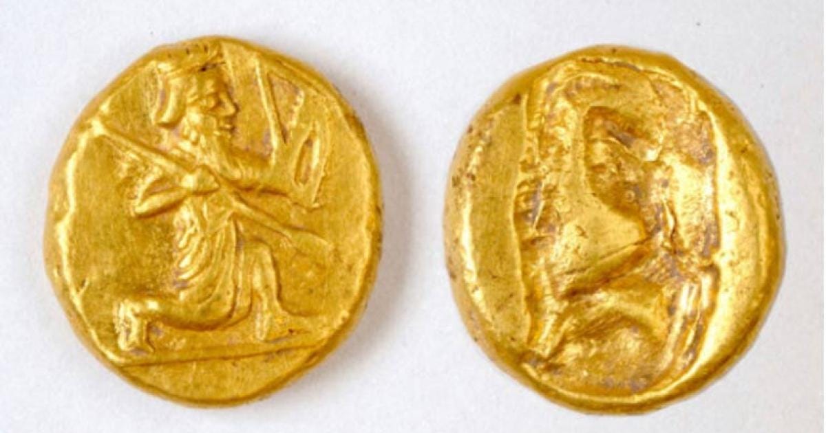 Archaeologists discovered a pot of gold Persian coins, called darics, at the ancient city of Notion in Turkey. The coins show a figure of a kneeling archer, the characteristic design of the Persian daric, a type of gold coin issued by the Persian Empire.	Source: Photo courtesy of Notion Archaeological Project, University of Michigan