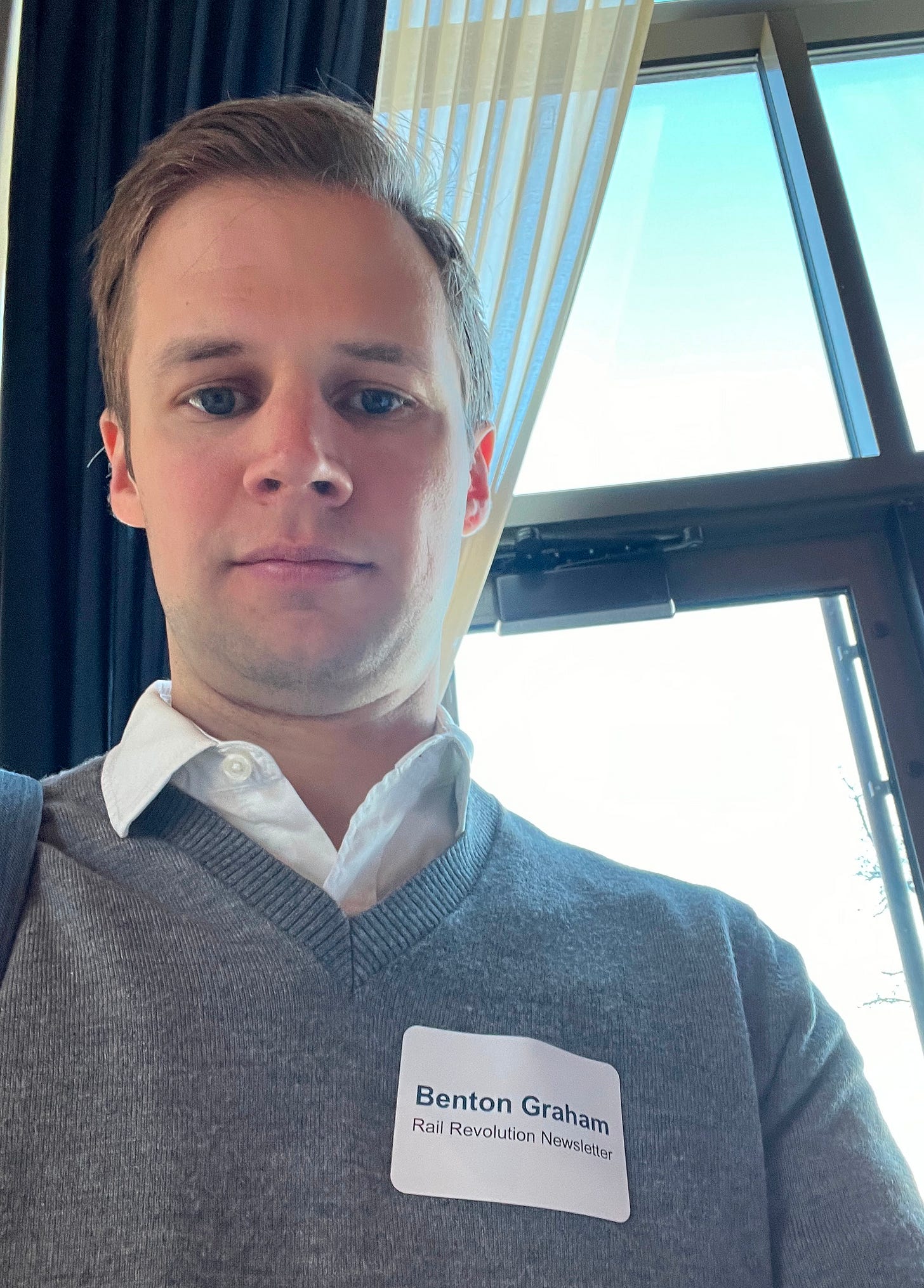 Benton Graham with a name tag that reads "Rail Revolution Newsletter"