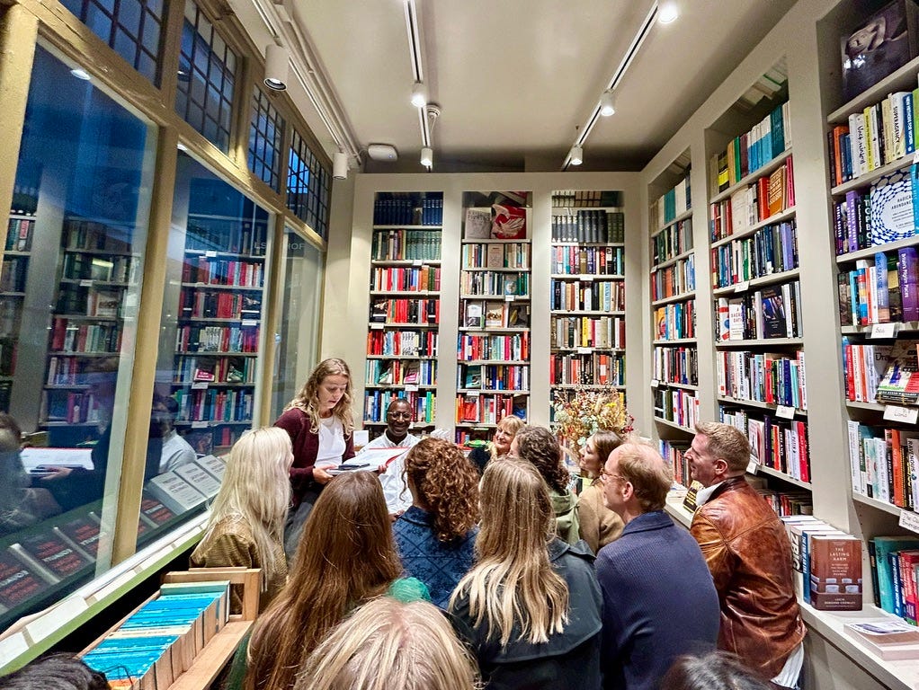 A small audience cosily seated in a tiny gem of a bookshop in London called The Gilded Acorn, which is ceiling to floor new and vintage books. The people are all here to listen to two writers ā Michael Kibedi and Ros Barber ā talk about their writing process. A small audience cosily seated in a tiny gem of a bookshop in London called The Gilded Acorn, which is ceiling to floor new and vintage books. The people are all here to listen to two writers ā Michael Kibedi and Ros Barber ā talk about their writing process.