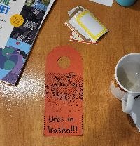 handmade doorhanger sign that reads Urbs in trasho