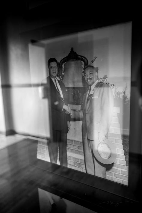 library books, image of MLK Jr. with then-college president, poster of Black leaders and inspirations, flowers, books