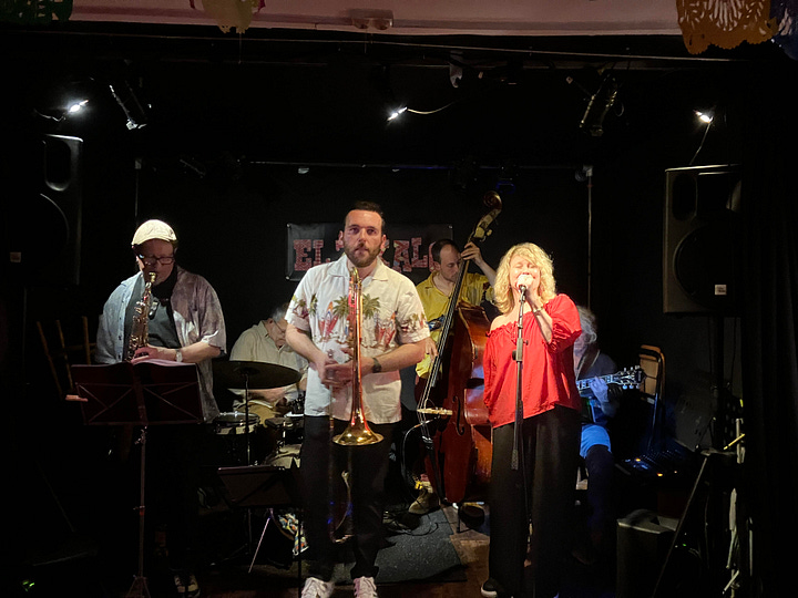 Scenes of a Parisian music venue called El Zokalo in the 20th arrondissment with a Mexican atmosphere and musicians performing