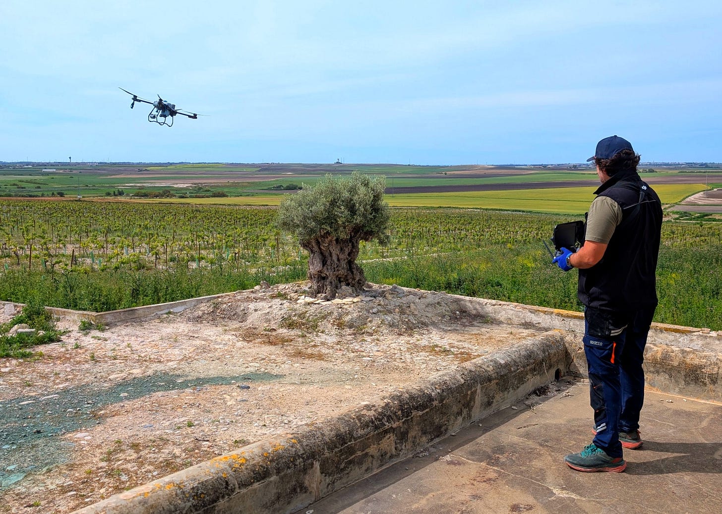 Raúl Morenio flying a drone over the vineyards of Dominio de las Animas
