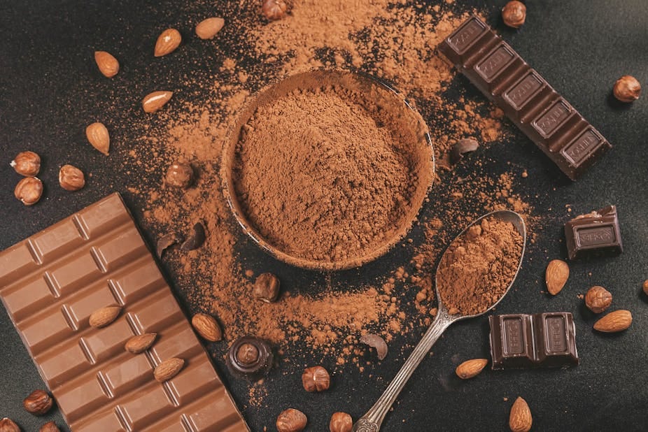 Chocolate powder and chocolate slab on a table
