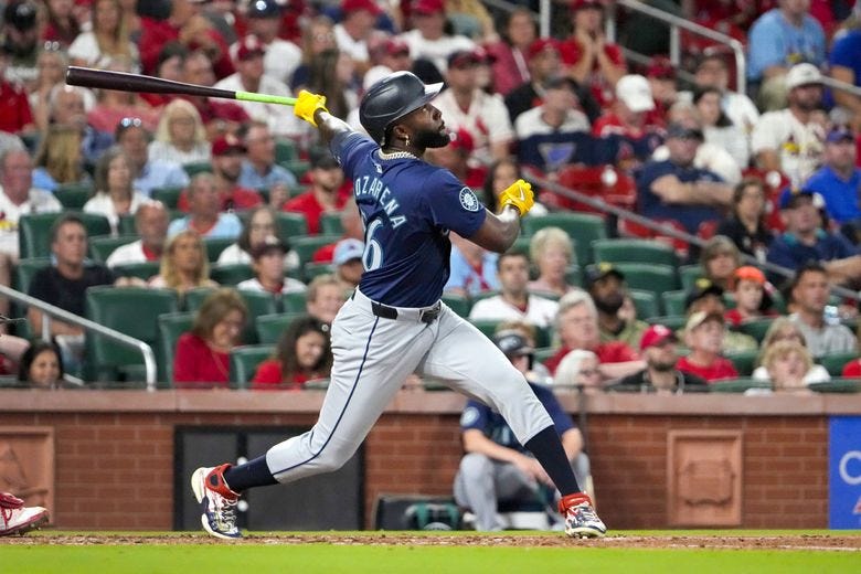 Seattle Mariners’ Randy Arozarena follows through on a sacrifice fly to score Victor Robles during the fifth inning of a baseball game against the St. Louis Cardinals Friday, Sept. 6, 2024, in St. Louis. (Jeff Roberson / AP) Seattle Mariners’ Randy Arozarena follows through on a sacrifice fly to score Victor Robles during the fifth inning of a baseball game against the St. Louis Cardinals Friday, Sept. 6, 2024, in St. Louis. (Jeff Roberson / AP)