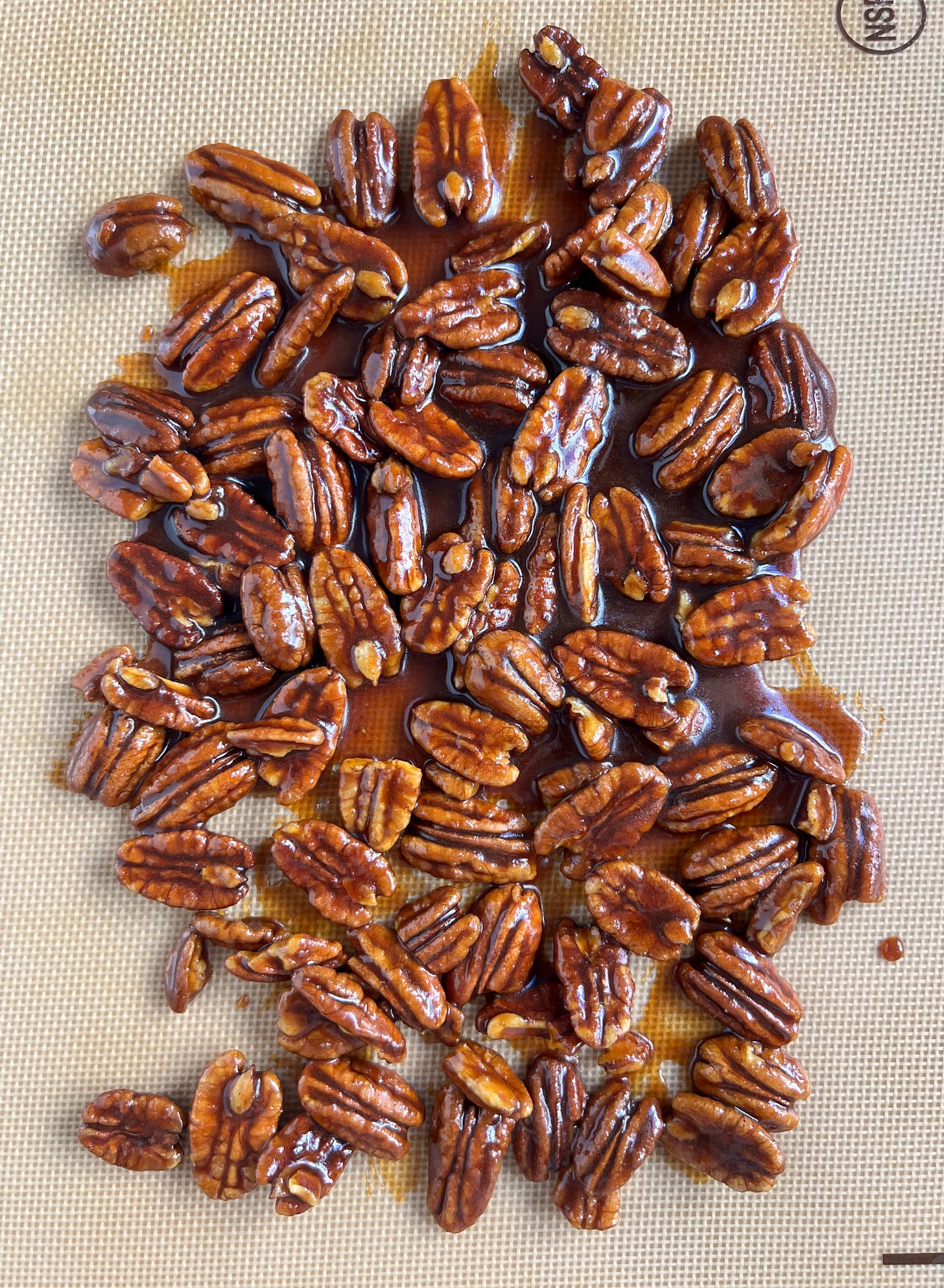 Glazed pecans ready for the oven. Glazed pecans ready for the oven.