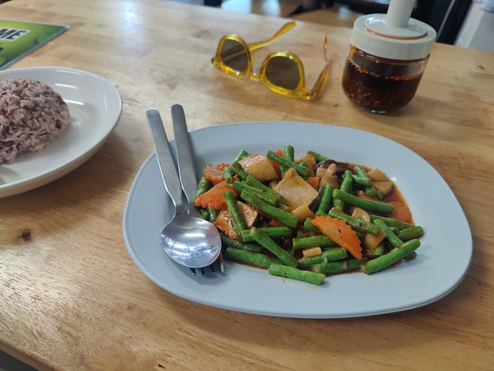 plate of food + menu page at eat me veggie + vegan