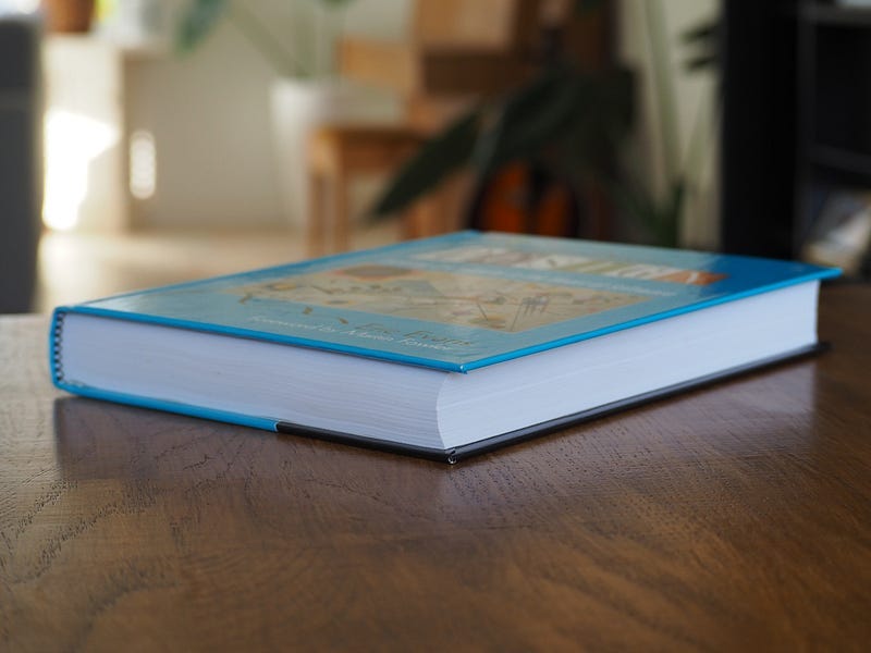 Book shown from side, illustrating its size